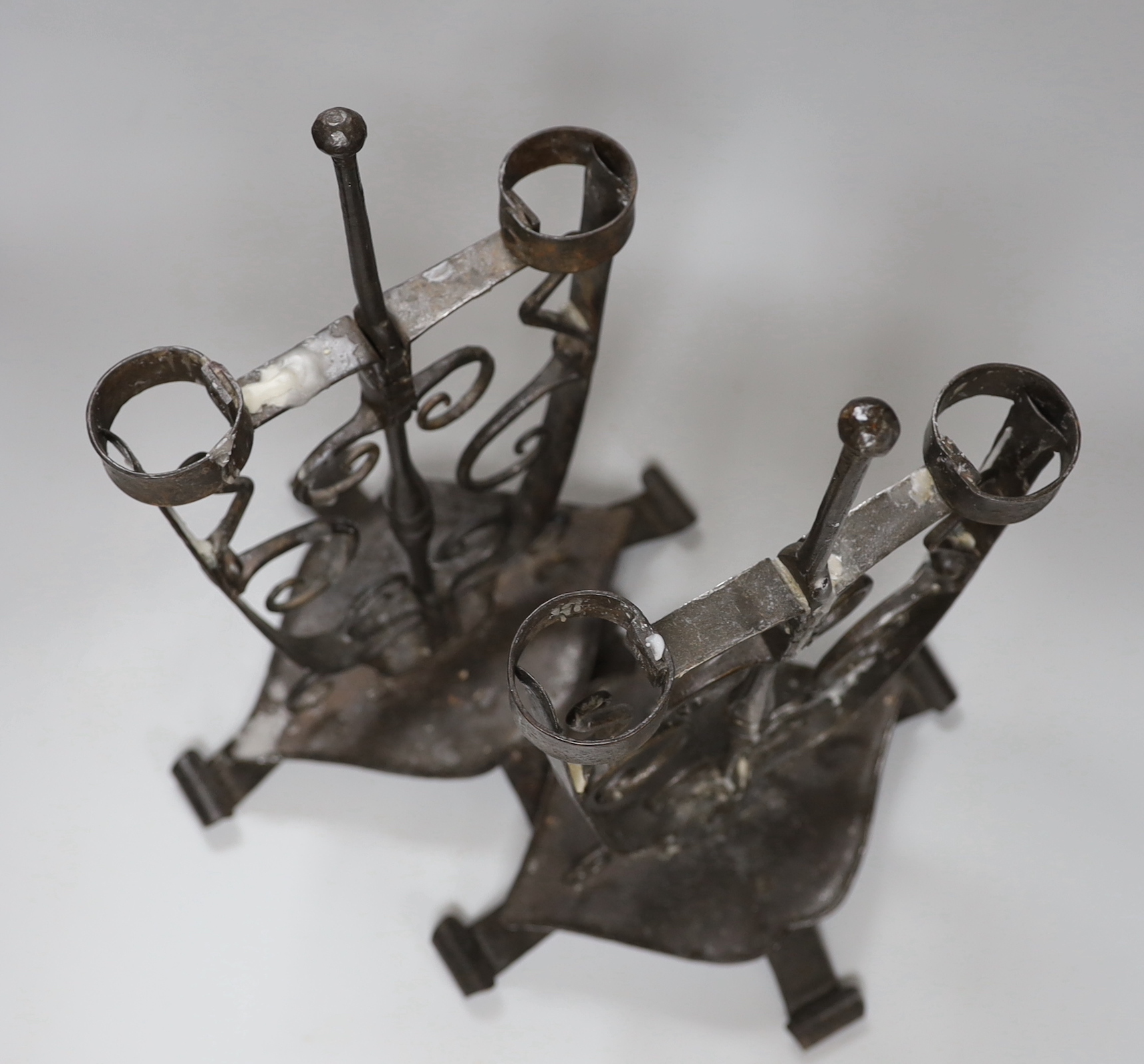 A pair of wrought iron candelabra, height 44.5cm